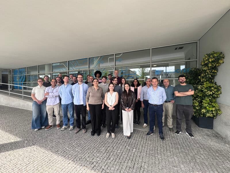 AI-EFFECT consortium group photo outside a glass office building