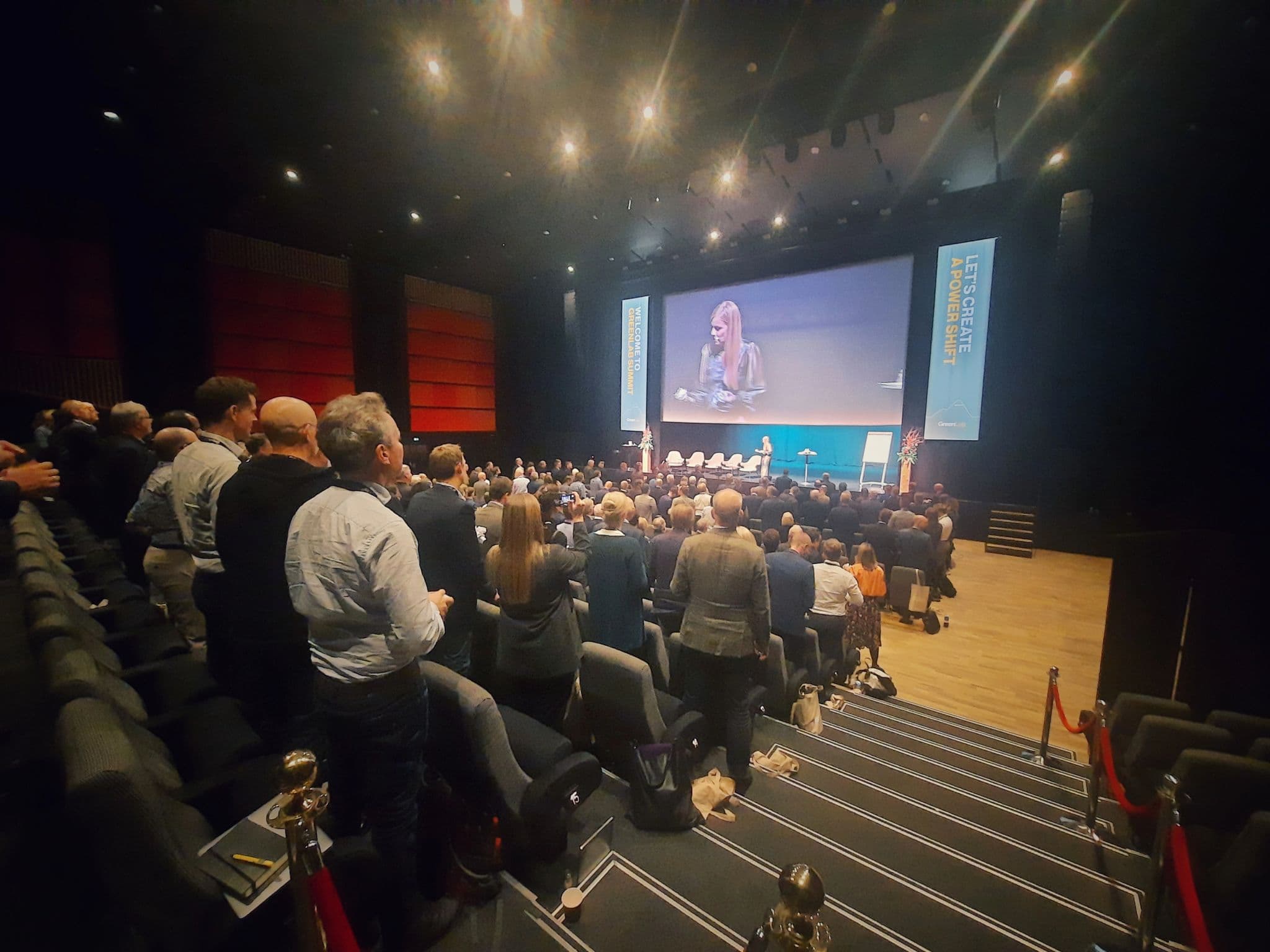 Audience in an auditorium at the GreenLab Summit